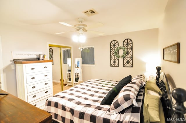 bedroom featuring ceiling fan, a closet, and visible vents