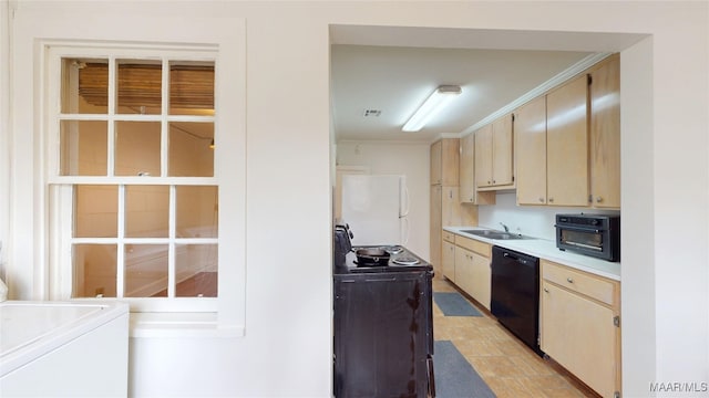 932 E Fairview Ave, Montgomery, AL 36106 - kitchen featuring a sink, black dishwasher, light countertops, freestanding refrigerator, and washer / clothes dryer