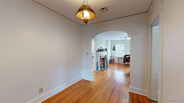932 E Fairview Ave, Montgomery, AL 36106 - hall featuring light wood-type flooring, baseboards, visible vents, and arched walkways