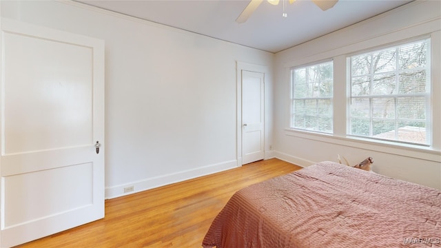 932 E Fairview Ave, Montgomery, AL 36106 - bedroom with a ceiling fan, baseboards, and light wood finished floors