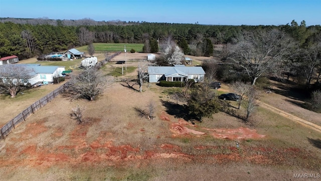 drone / aerial view featuring a forest view and a rural view