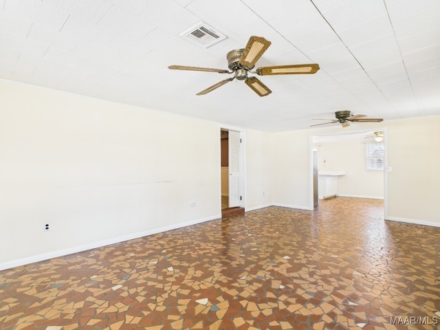 spare room with visible vents and baseboards