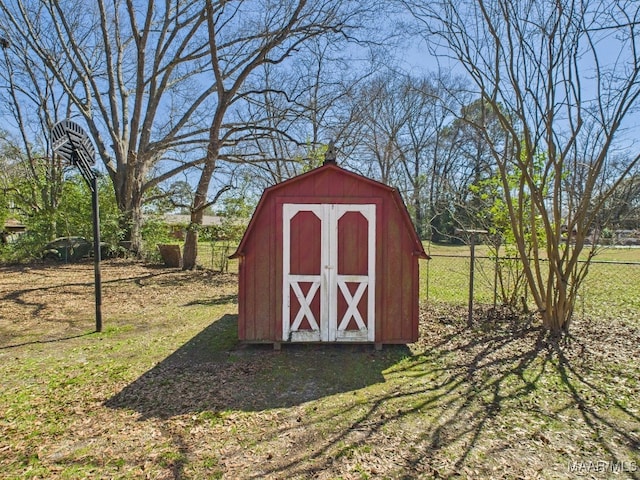 view of shed with fence