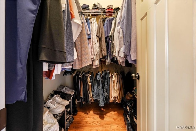 spacious closet with wood finished floors