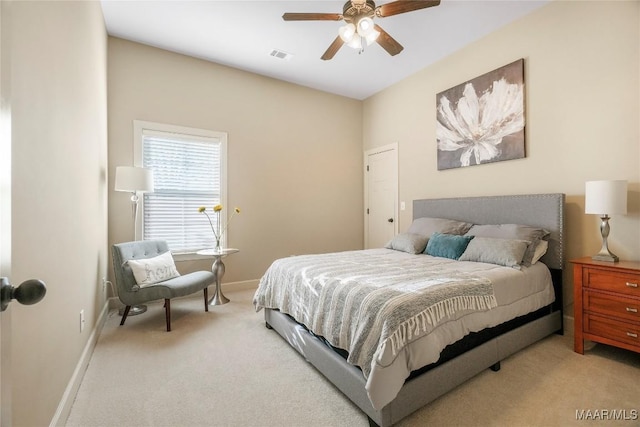 carpeted bedroom with visible vents, ceiling fan, and baseboards