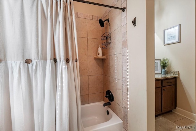 bathroom featuring vanity, baseboards, and shower / bath combo with shower curtain