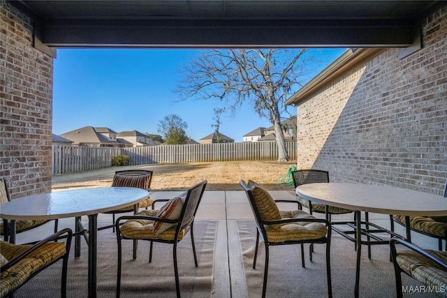 view of patio / terrace with a fenced backyard and outdoor dining space