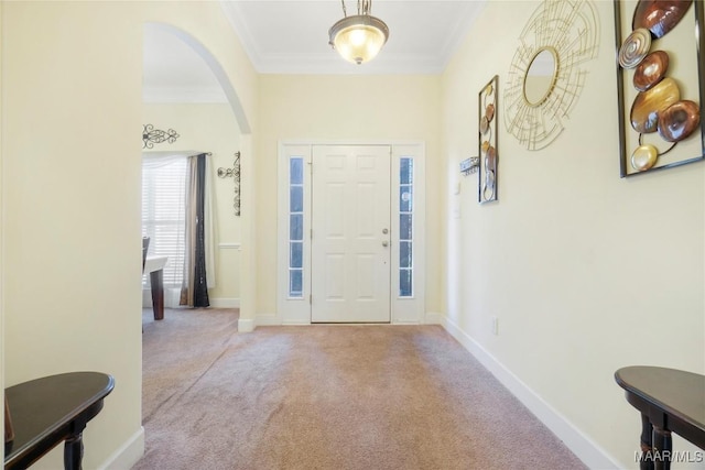 7148 Rough Rd, Montgomery, AL 36116 - carpeted foyer featuring crown molding, arched walkways, and baseboards