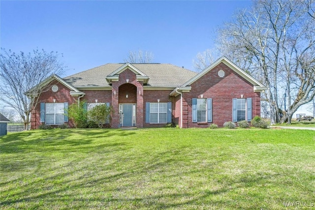 7148 Rough Rd, Montgomery, AL 36116 - view of front of property featuring brick siding, a shingled roof, and a front lawn