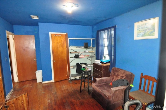 sitting room featuring wood finished floors and baseboards