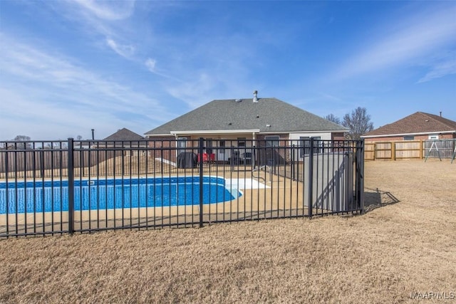 view of swimming pool with a patio area, fence, and a fenced in pool