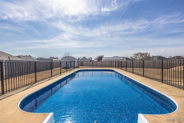 view of pool with a fenced backyard and a fenced in pool