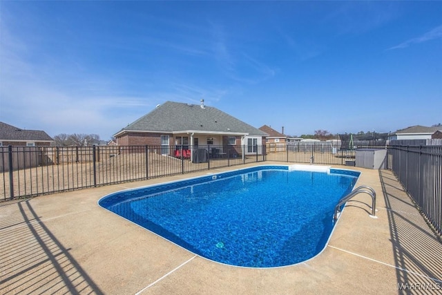 view of pool with fence, a fenced in pool, and a patio