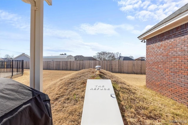 view of yard with a fenced backyard