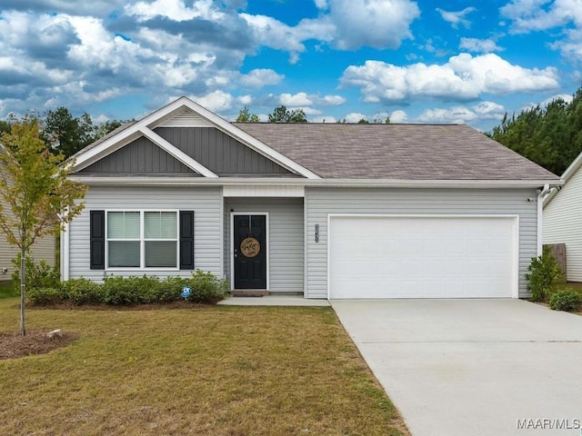 view of front of house featuring a garage, concrete driveway, a front lawn, and a shingled roof