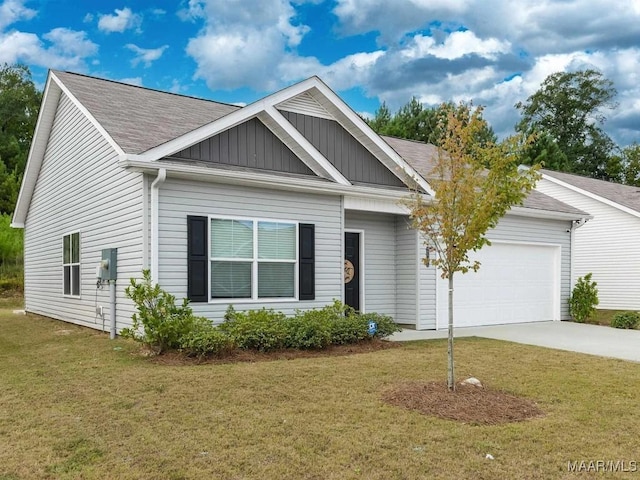 view of front of home featuring an attached garage, driveway, a front lawn, and board and batten siding