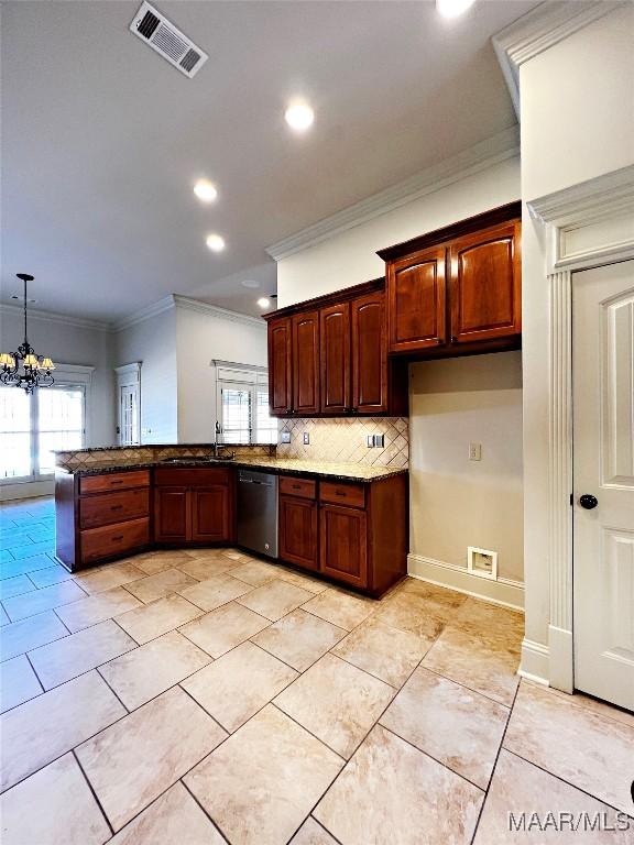 kitchen with tasteful backsplash, visible vents, dishwasher, a peninsula, and crown molding