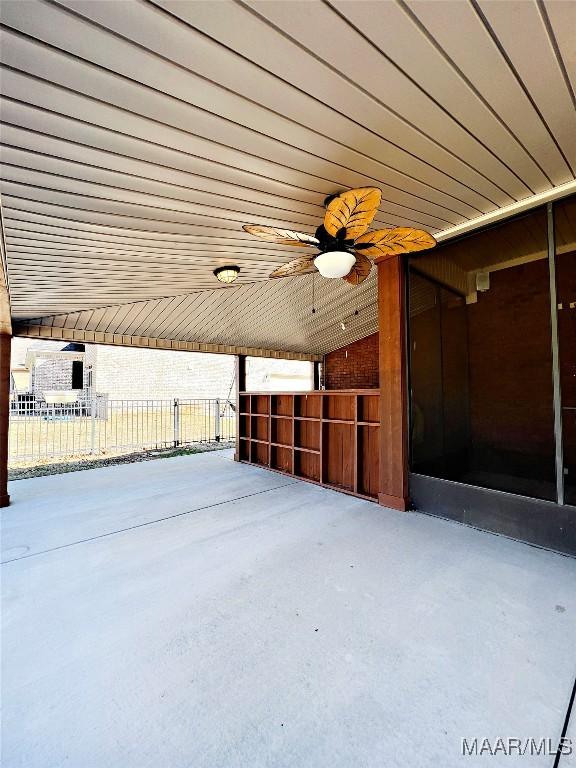 view of patio with ceiling fan, an outdoor structure, and an exterior structure