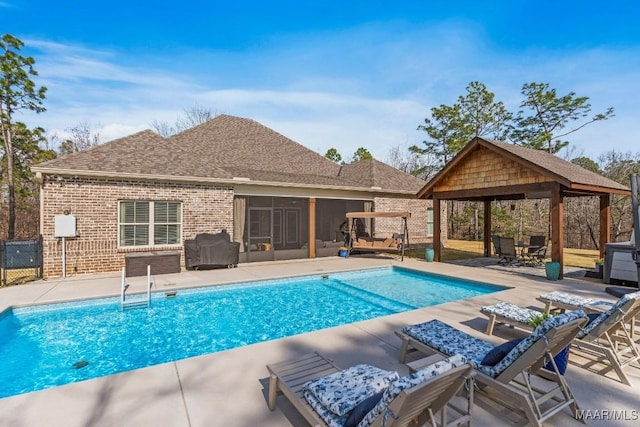 view of swimming pool featuring a gazebo, a patio area, and a fenced in pool