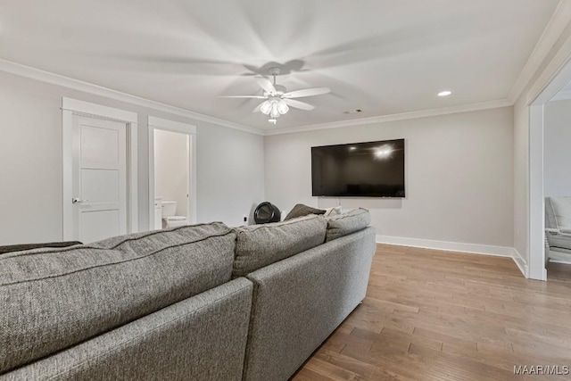 living room featuring crown molding, recessed lighting, a ceiling fan, wood finished floors, and baseboards