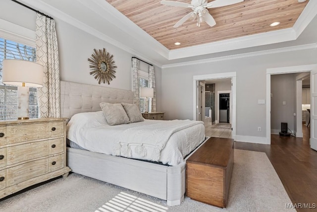 bedroom featuring ornamental molding, a raised ceiling, wooden ceiling, and wood finished floors