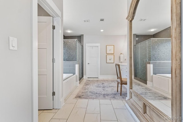 full bathroom with marble finish floor, a stall shower, a garden tub, and visible vents