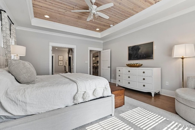 bedroom with a tray ceiling, wooden ceiling, crown molding, and recessed lighting