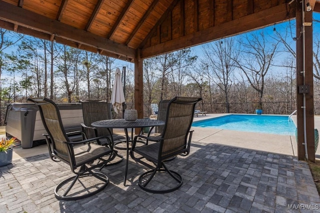 view of patio / terrace featuring fence and a fenced in pool