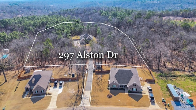 aerial view featuring a wooded view