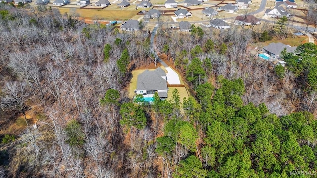 birds eye view of property with a residential view