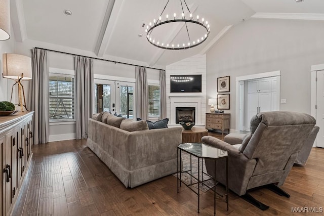 living room featuring high vaulted ceiling, dark wood-style flooring, a fireplace, and french doors