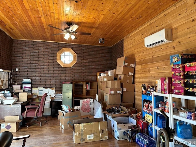 storage room featuring ceiling fan and a wall unit AC