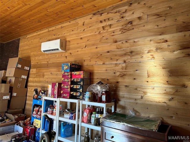 storage room with a wall mounted air conditioner