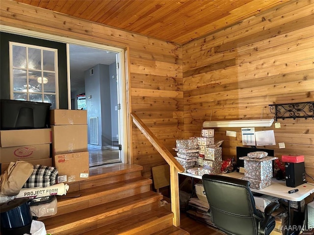 stairway with wooden walls and wood ceiling
