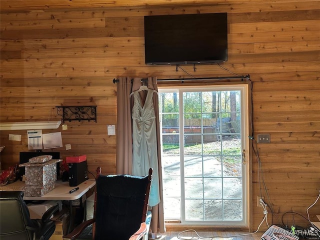 doorway featuring wood walls