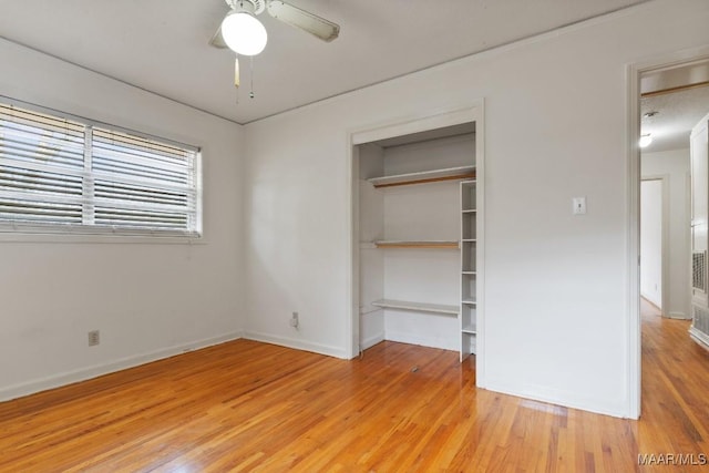 unfurnished bedroom with a ceiling fan, light wood-type flooring, a closet, and baseboards