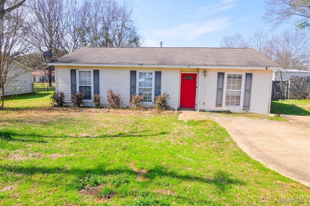 single story home with fence and a front lawn