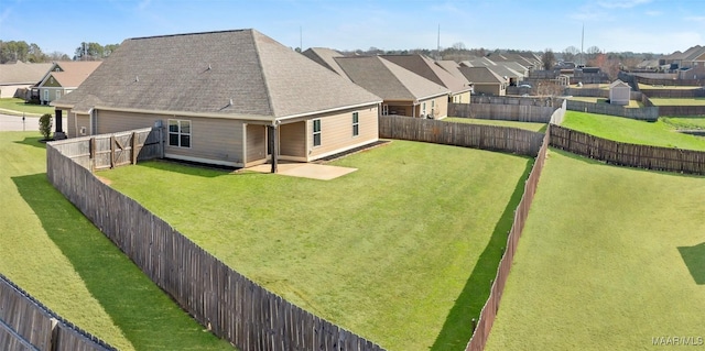 view of yard featuring a residential view and a fenced backyard