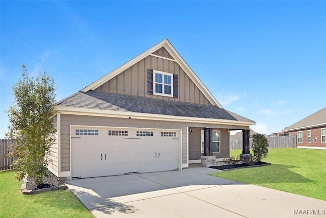 view of front of property with board and batten siding, fence, driveway, and a front lawn