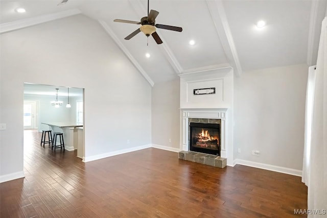 unfurnished living room featuring a fireplace, baseboards, and dark wood-style flooring