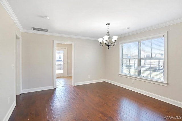 unfurnished room with dark wood-style floors, baseboards, visible vents, and crown molding