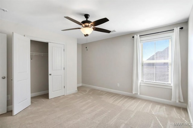 unfurnished bedroom with visible vents, baseboards, a closet, and light colored carpet