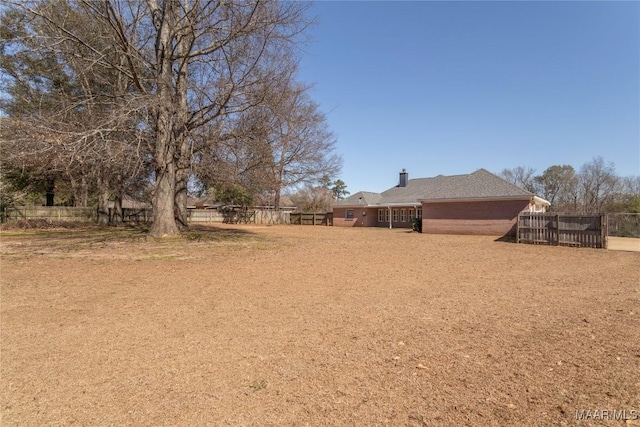 view of yard featuring fence