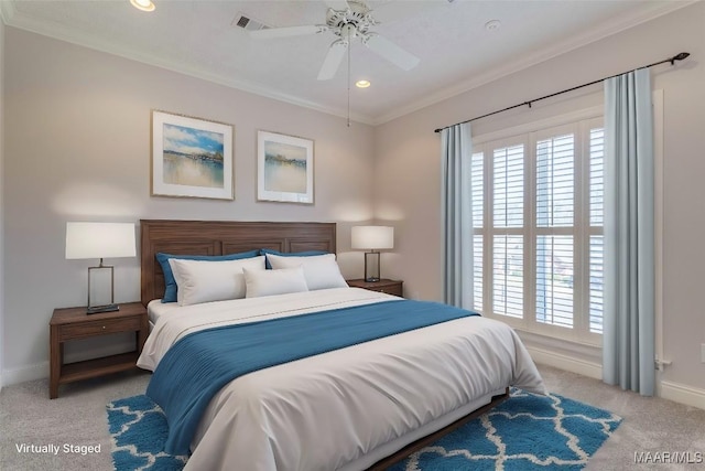 carpeted bedroom with ceiling fan, recessed lighting, visible vents, baseboards, and crown molding