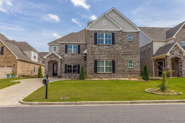 view of front of home with driveway, brick siding, and a front yard