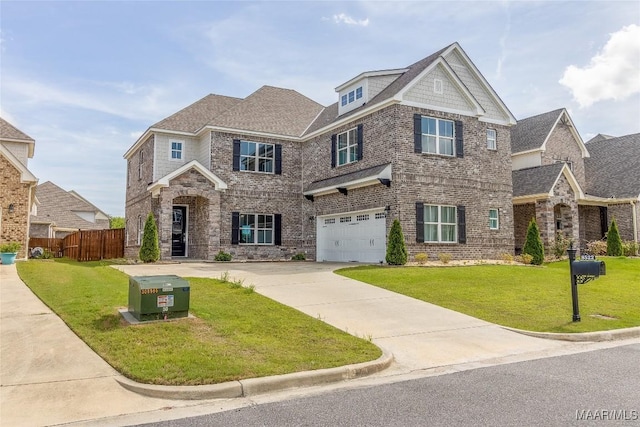 craftsman-style home featuring an attached garage, brick siding, fence, concrete driveway, and a front yard