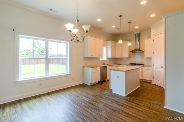 kitchen featuring white cabinets, wall chimney range hood, dishwasher, tasteful backsplash, and dark wood finished floors