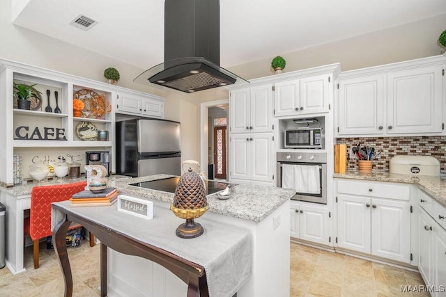 kitchen with island range hood, white cabinetry, visible vents, appliances with stainless steel finishes, and backsplash