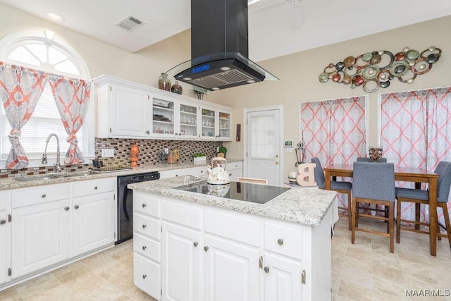 kitchen featuring a sink, a center island, black appliances, tasteful backsplash, and island exhaust hood