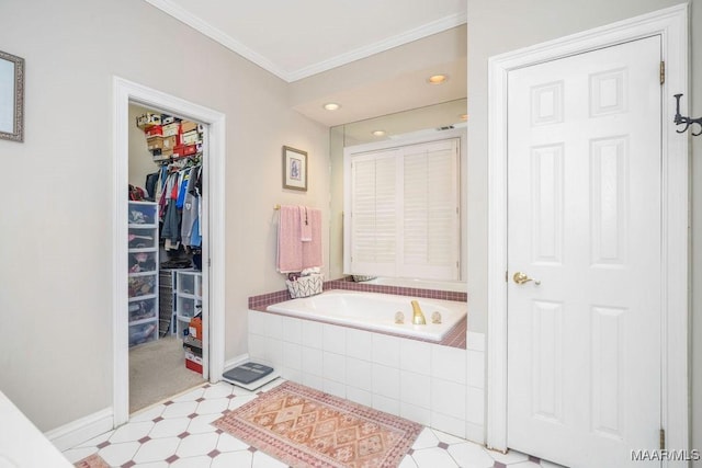 bathroom with baseboards, ornamental molding, tile patterned floors, a spacious closet, and a bath